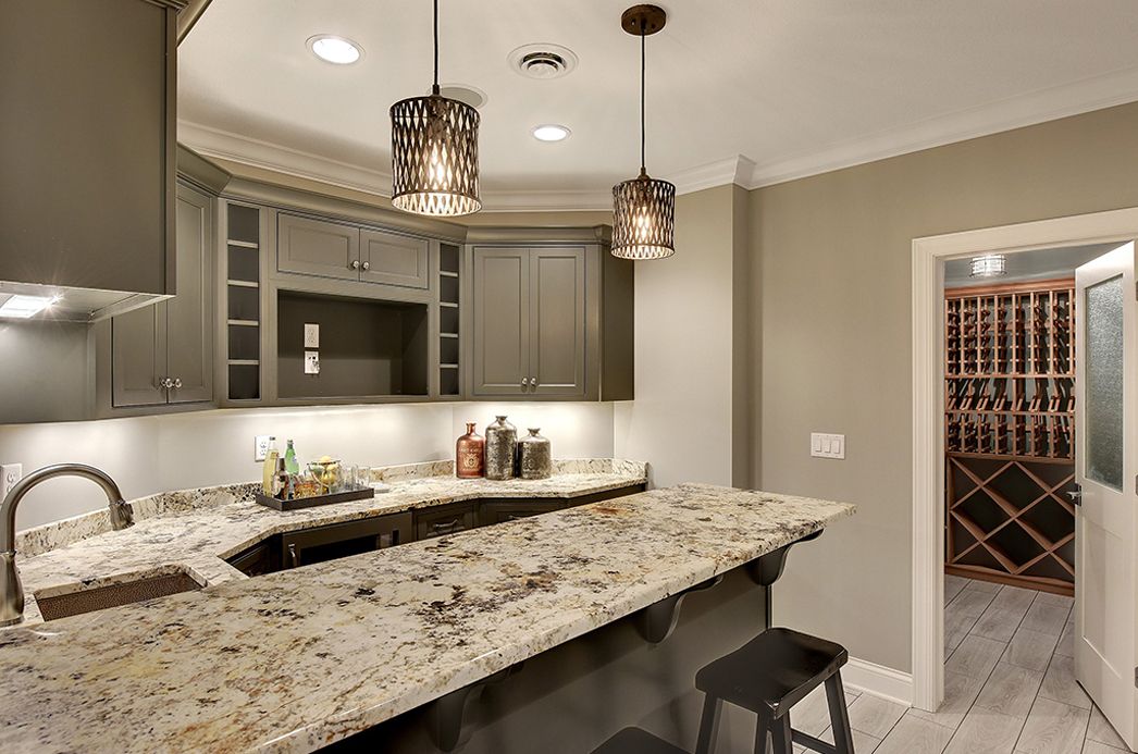 Curved granite bar & wine room — Bars & Basements