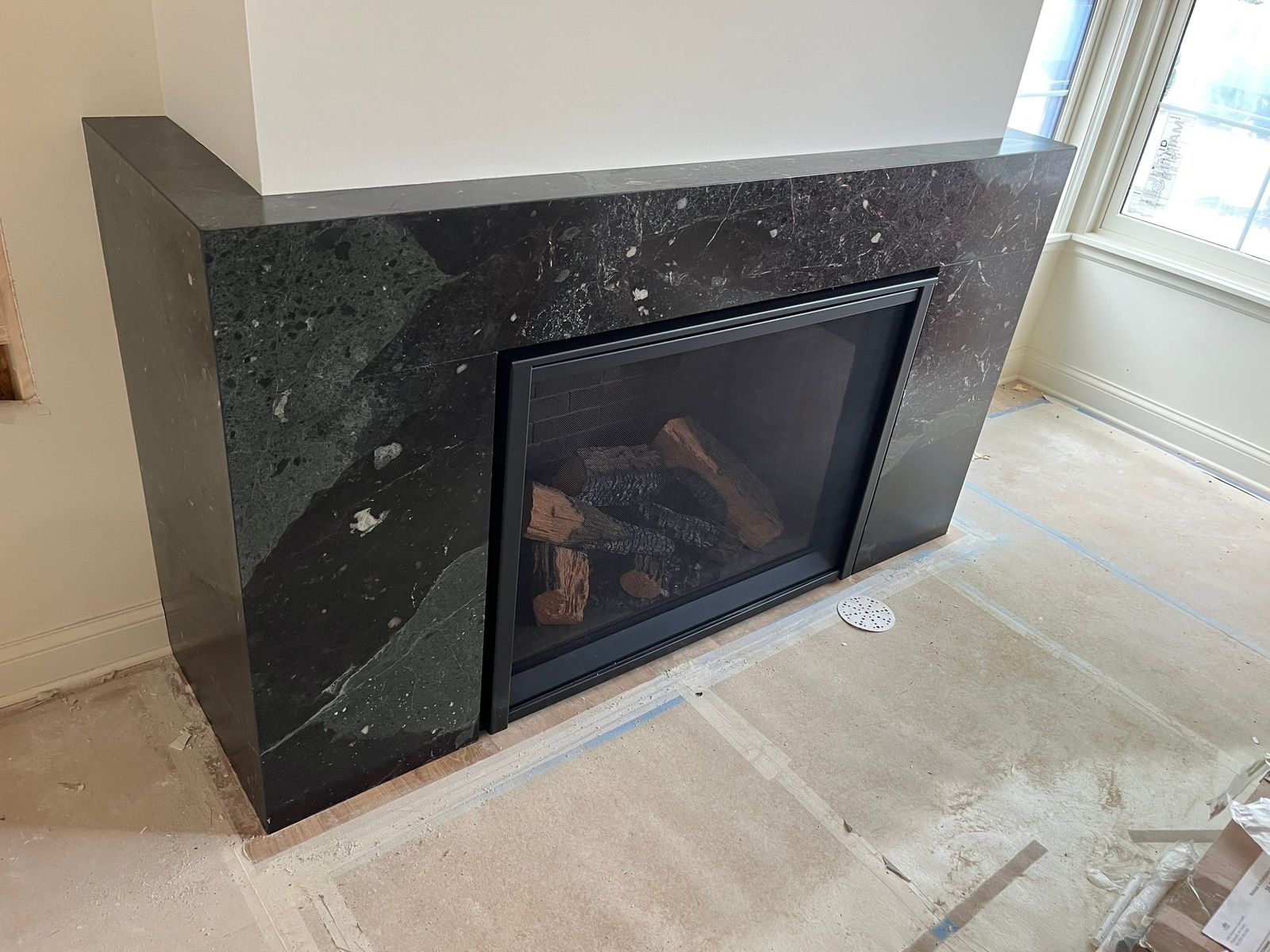 Black granite surround — Fireplaces